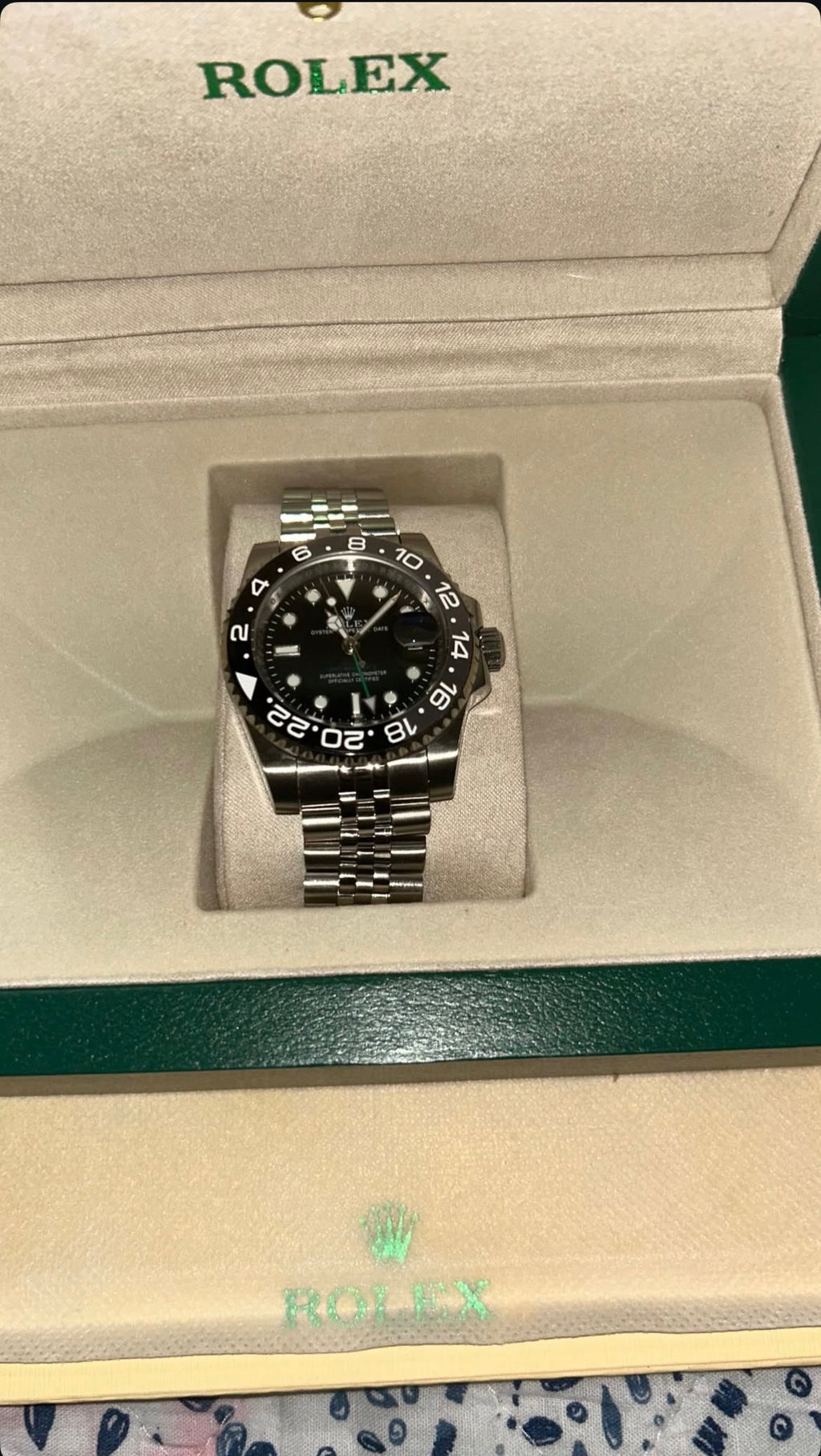 Rolex with paper and box