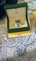 Rolex with paper and box